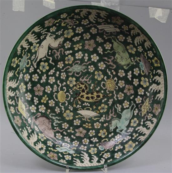 A rare Chinese enamelled biscuit (susancai) nine horses dish, Kangxi period (1662-1722), diameter 32.5cm, slight faults